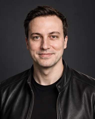 Studio portrait of Dobromir Kraychev in a black leather jacket